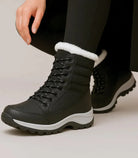Zwart-witte dames snowboots met bontkraag en midkuitschacht
