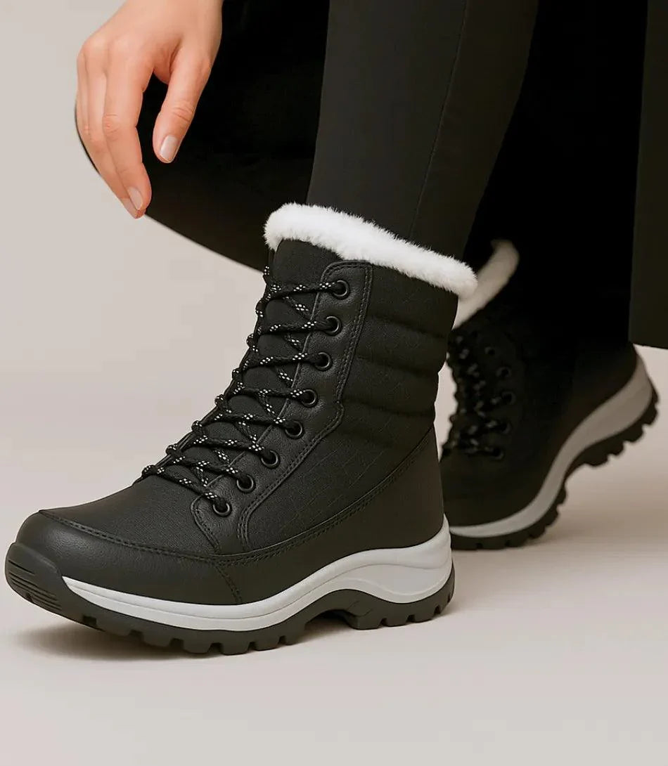 Zwart-witte dames snowboots met bontkraag en midkuitschacht