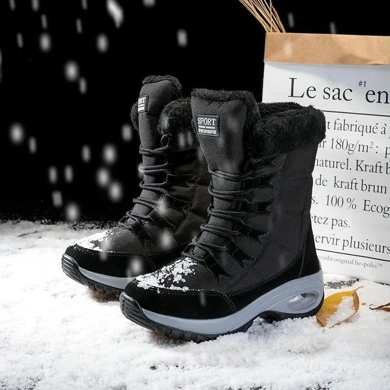 Sylva laarzen gecombineerd met jeans en lange jas winterlook