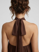 Paloma mini-jurk zwart met elegante open rug en gelaagde ruches