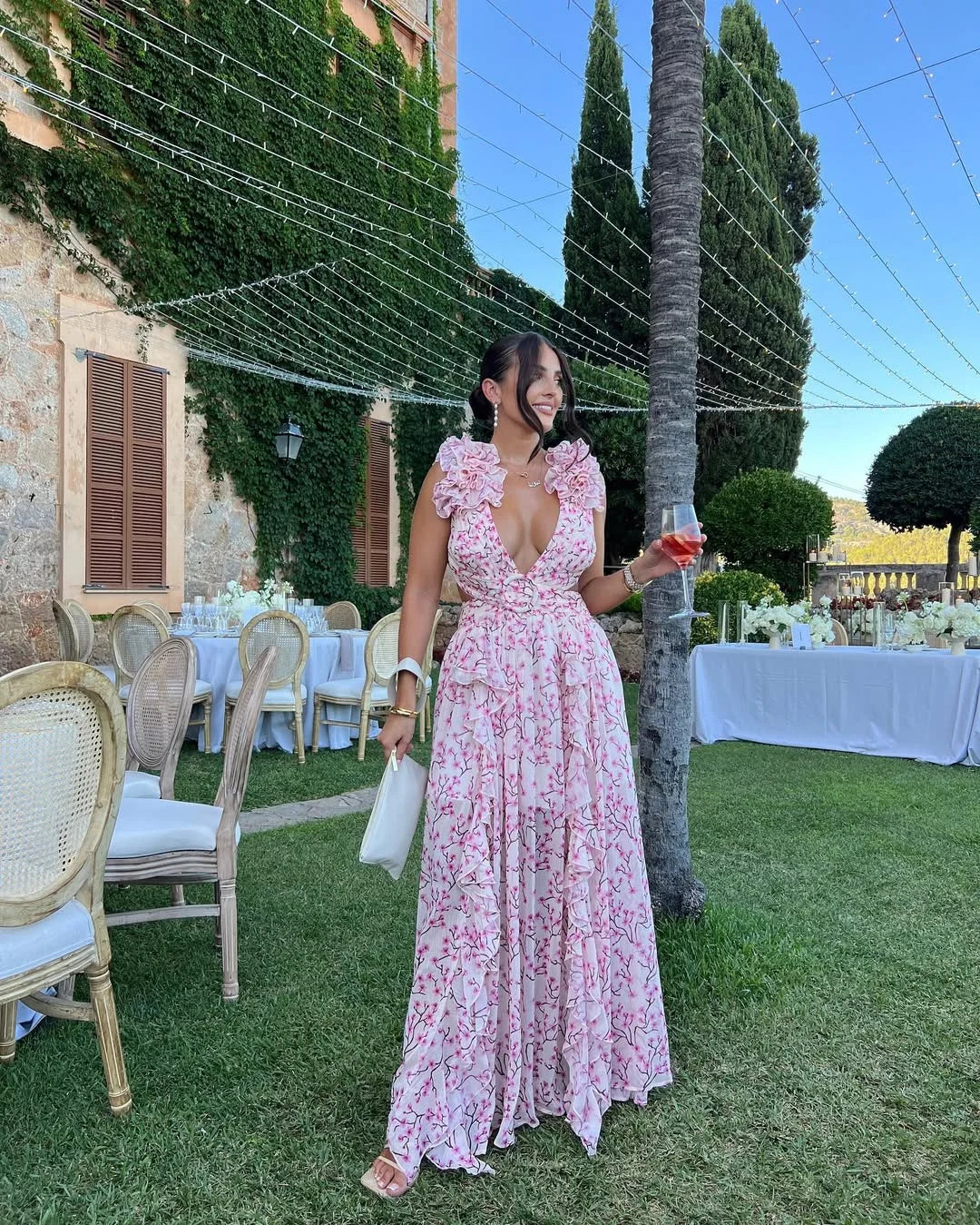 Mouwloze dames maxi-jurk met moderne snit en bloemendessin