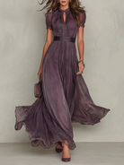 Violaine dames maxi jurk in violet met hoge hals en pofmouwen